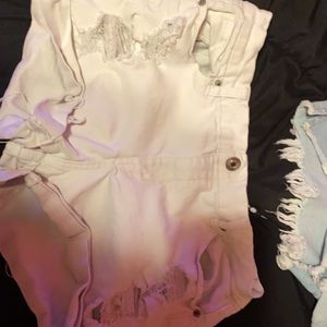 White jean shorts worn once. Washed (bottoms are just ruffled up)